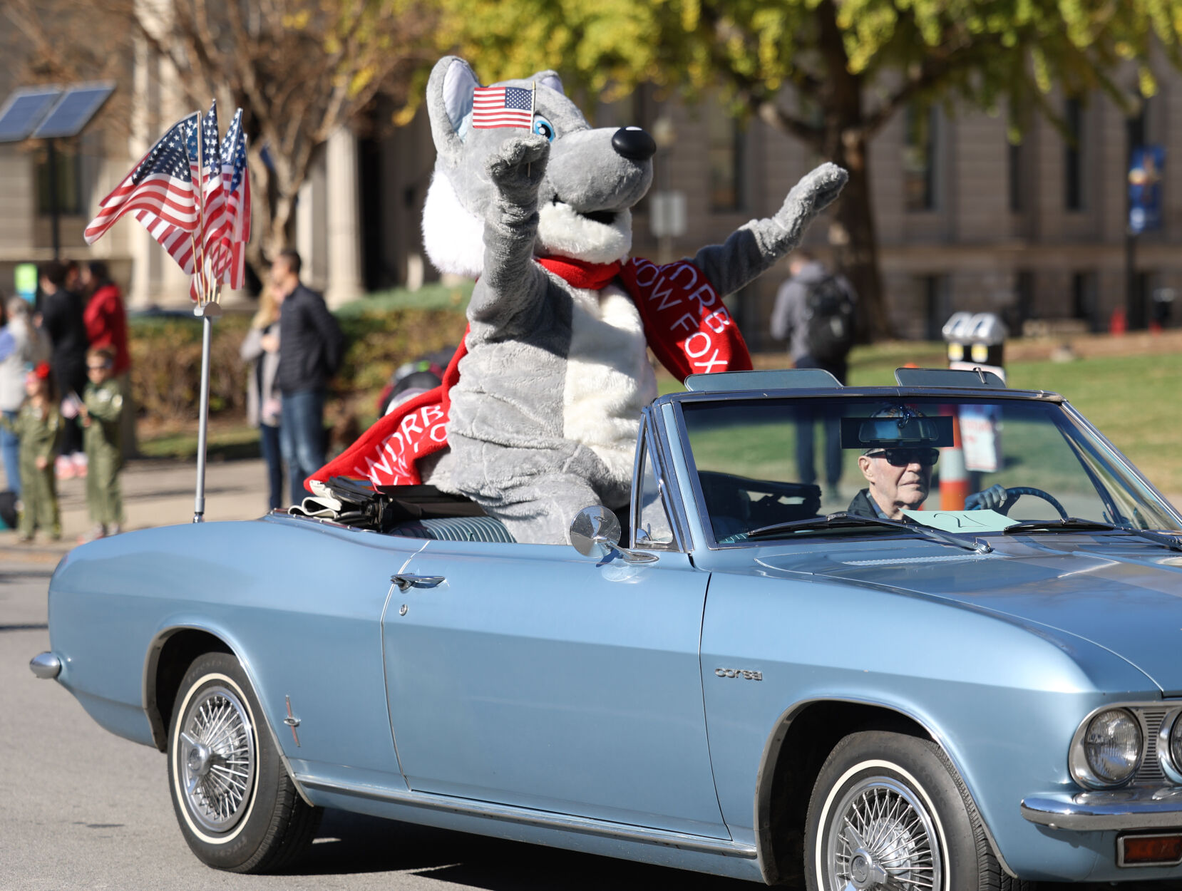 WDRB Snow Fox waves at parade.JPG